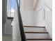 Elegant staircase with white railings and wood steps at 34 Peachtree Ne Cir, Atlanta, GA 30309