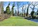 Large backyard with lush lawn and storage shed at 727 Charlotte Nw Pl, Atlanta, GA 30318