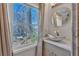 Bright bathroom with updated vanity and a large window at 727 Charlotte Nw Pl, Atlanta, GA 30318