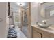 Elegant bathroom featuring a glass shower, soaking tub, and modern vanity at 727 Charlotte Nw Pl, Atlanta, GA 30318