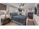 Bedroom with a queen bed, ceiling fan, and access to a private bathroom at 727 Charlotte Nw Pl, Atlanta, GA 30318
