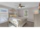 Spacious bedroom with a queen bed, ceiling fan, and ample natural light at 727 Charlotte Nw Pl, Atlanta, GA 30318