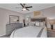 Cozy bedroom with a queen bed, ceiling fan, and large mirror at 727 Charlotte Nw Pl, Atlanta, GA 30318