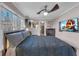 Bedroom with a queen bed, ceiling fan, and access to a private bathroom at 727 Charlotte Nw Pl, Atlanta, GA 30318