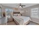 Comfortable bedroom with a queen bed and ceiling fan at 727 Charlotte Nw Pl, Atlanta, GA 30318