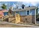 Gray house with stone accents and a large deck at 727 Charlotte Nw Pl, Atlanta, GA 30318