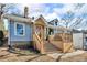 Charming gray house with stone accents, a deck, and steps leading to the entrance at 727 Charlotte Nw Pl, Atlanta, GA 30318