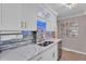 Modern kitchen with white shaker cabinets and stainless steel appliances at 727 Charlotte Nw Pl, Atlanta, GA 30318