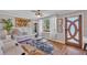 Living room with hardwood floors, comfortable seating, and a fireplace at 727 Charlotte Nw Pl, Atlanta, GA 30318