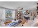 Open living area with hardwood floors, fireplace, and large window at 727 Charlotte Nw Pl, Atlanta, GA 30318