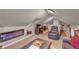 Spacious loft with electric fireplace and seating area at 727 Charlotte Nw Pl, Atlanta, GA 30318