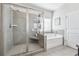 Bathroom featuring a standalone shower and tub setup at 2090 Red Barn Ct, Cumming, GA 30040