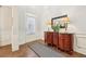 Entryway featuring hardwood floors, foyer table with lamps, and front door at 2090 Red Barn Ct, Cumming, GA 30040