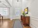 Entryway featuring hardwood floors, foyer table with lamps, and front door at 2090 Red Barn Ct, Cumming, GA 30040
