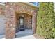 Elegant front entrance with brick detailing and arched entryway at 2090 Red Barn Ct, Cumming, GA 30040