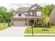 Beautiful two-story brick home with a well-manicured lawn and two car garage in a lovely neighborhood at 2090 Red Barn Ct, Cumming, GA 30040