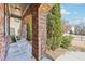 Inviting front porch with rocking chairs and brick columns at 2090 Red Barn Ct, Cumming, GA 30040