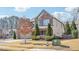 Two-story house with brick and beige siding at 2090 Red Barn Ct, Cumming, GA 30040