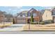 Two-story house with brick and beige siding at 2090 Red Barn Ct, Cumming, GA 30040