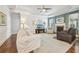 Inviting living room with a fireplace, plush seating, hardwood floors, and plenty of natural light at 2090 Red Barn Ct, Cumming, GA 30040