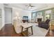 Comfortable living room with a fireplace, plush seating, hardwood floors, and natural lighting at 2090 Red Barn Ct, Cumming, GA 30040