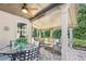 Cozy covered patio with wicker furniture at 2090 Red Barn Ct, Cumming, GA 30040