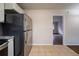 Kitchen with stainless steel appliances and view into living room at 3738 Larkspur Ter, Decatur, GA 30032