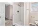 Clean bathroom with a tiled shower and grab bars at 4071 Williamsburg Dr, Atlanta, GA 30337