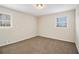Bright bedroom featuring neutral walls and carpet at 4071 Williamsburg Dr, Atlanta, GA 30337