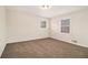 Spacious bedroom with neutral walls and carpet at 4071 Williamsburg Dr, Atlanta, GA 30337