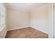 Cozy bedroom with hardwood floors and neutral walls at 4071 Williamsburg Dr, Atlanta, GA 30337