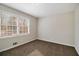 Well-lit bedroom with neutral walls and carpet at 4071 Williamsburg Dr, Atlanta, GA 30337