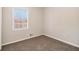 Simple bedroom with carpet and a window at 4071 Williamsburg Dr, Atlanta, GA 30337