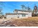 Gray house with large backyard at 4071 Williamsburg Dr, Atlanta, GA 30337