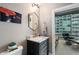 Chic bathroom with modern vanity and view of city skyline at 943 Peachtree Ne St # 1408, Atlanta, GA 30309