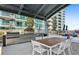 Community outdoor kitchen with stainless steel appliances and seating at 943 Peachtree Ne St # 1408, Atlanta, GA 30309