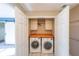 Convenient laundry room with washer, dryer, and folding counter at 1550 Park Creek Ne Ln, Brookhaven, GA 30319