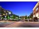 Night view of a vibrant town square with shops and restaurants at 1550 Park Creek Ne Ln, Brookhaven, GA 30319