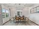 Bright dining room with a wood table and modern chandelier at 2771 Dolce Rd, Dacula, GA 30019