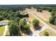 Aerial view of house on large lot with surrounding trees and nearby roads at 627 Honey Creek Rd, Mcdonough, GA 30252