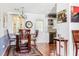 Bright dining area with tile floors and a charming chandelier at 627 Honey Creek Rd, Mcdonough, GA 30252