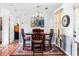 Cozy dining room with tile floors and decorative wall art at 627 Honey Creek Rd, Mcdonough, GA 30252