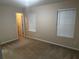 Bright bedroom with neutral walls and carpet at 990 Harbins Rd # 5D, Norcross, GA 30093