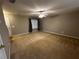 Carpeted bedroom with neutral walls and a ceiling fan at 990 Harbins Rd # 5D, Norcross, GA 30093