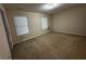 Bright bedroom with neutral walls and carpet at 990 Harbins Rd # 5D, Norcross, GA 30093