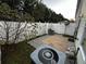 Small fenced patio with concrete pavers and a tree at 990 Harbins Rd # 5D, Norcross, GA 30093