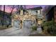 Stunning stone front exterior boasts a two-car garage and manicured landscaping at 1048 Standard Ne Dr, Atlanta, GA 30319