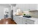 Modern kitchen with white cabinets, quartz countertops and breakfast bar at 1048 Standard Ne Dr, Atlanta, GA 30319