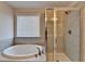 Bathroom with shower and garden tub at 2329 Village Grove Dr, Suwanee, GA 30024