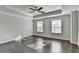 Spacious bedroom featuring hardwood floors and a ceiling fan at 2329 Village Grove Dr, Suwanee, GA 30024